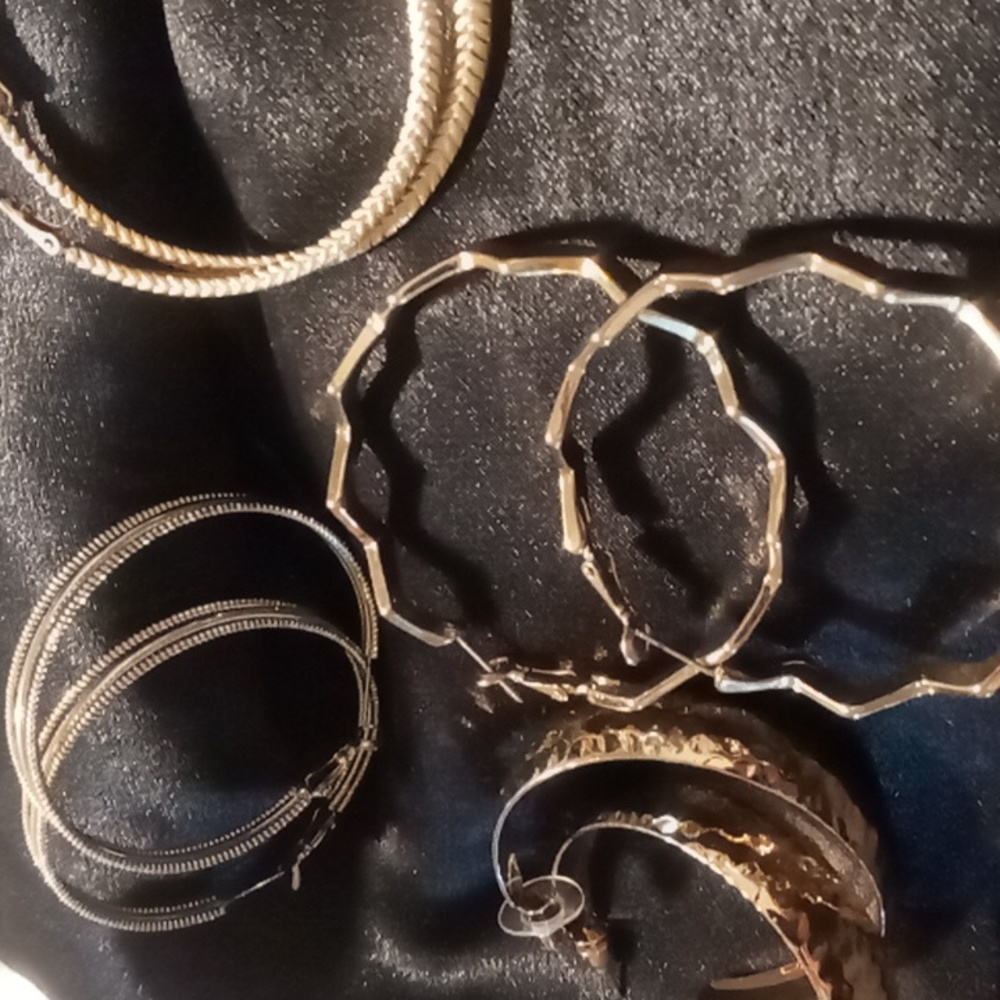 Hoop earrings gold tone all 4 pairs new with out tags.